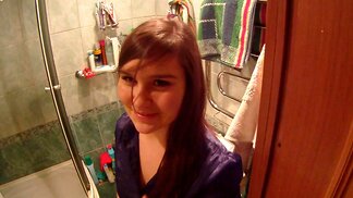 Horny dude is filming this shy chick in the bathroom