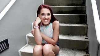 Cutie with red hair blows cock on the stairs after interview