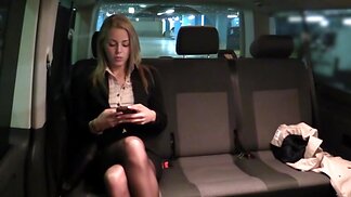 Taxi driver takes care of bored blonde girl in the backseat