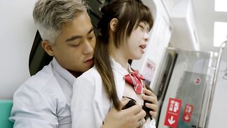 Asian girl in a schoolgirl outfit is fucked on the train