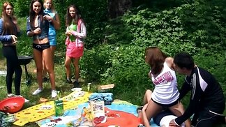 Naughty babes merge bodies and start touching pussies at picnic