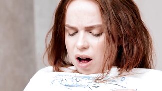 Petite redhead Luna Haze teasing her clit while sittign