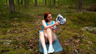 Redhead fox takes all the clothes off and masturbates in the wood