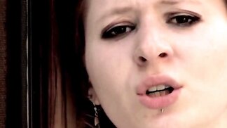 Redheaded Ivy B puts a purple dildo in her wet pussy
