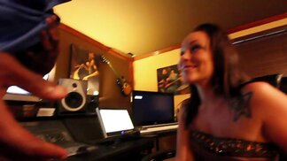 Tatted petite brunette gives messy BJ in studio booth