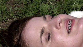 Teen in braces enjoys lesbian licking and fingering outside