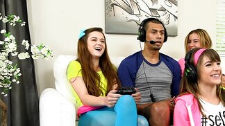 Three teen babes seduce a gamer and suck his huge dick